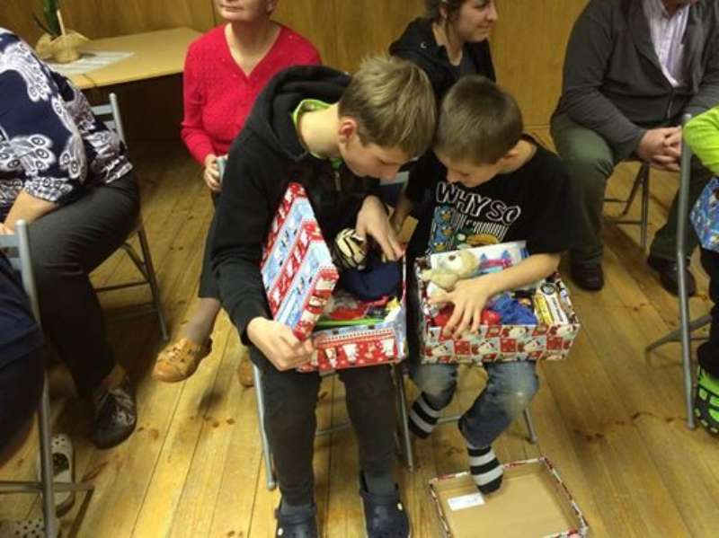 Latvian boys receiving gifts
