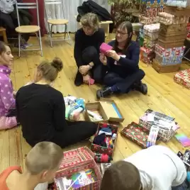Kids receiving their Christmas gifts 