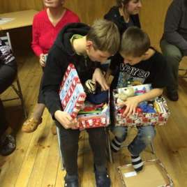 Latvian boys receiving gifts