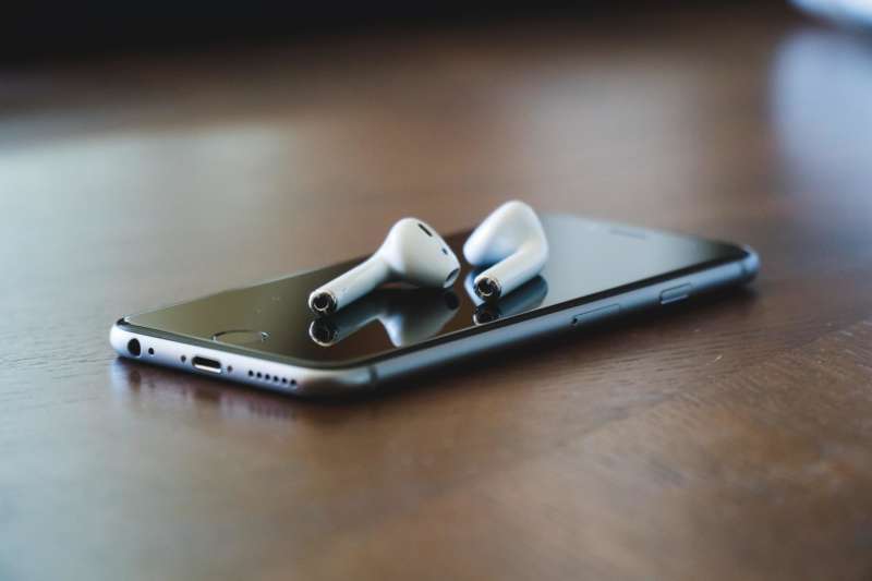 Phone and ear pods on table