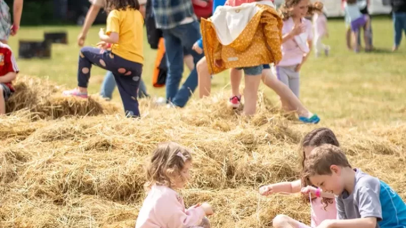 Kids playing in the hay bales at Nua Festival