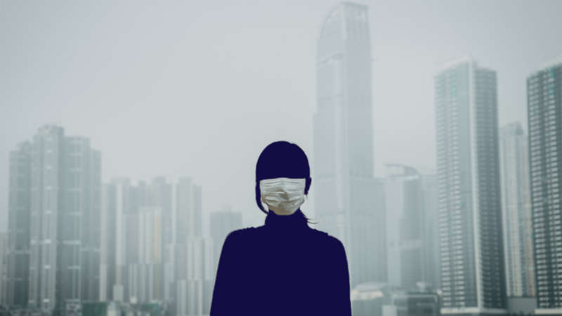 Girl with mask in city