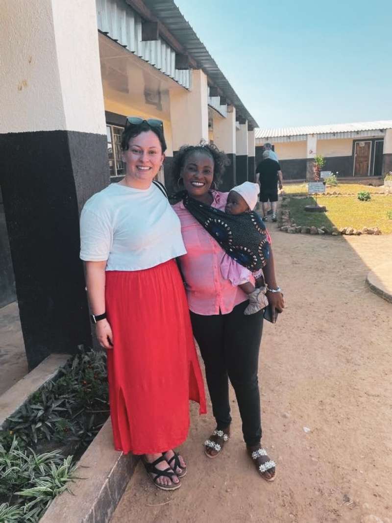 Amy and friend with baby in Zambia