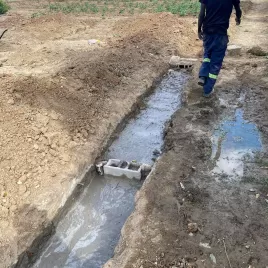 Digging drainage at Mama Rachel's Soup Kitchen